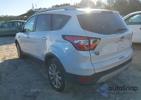 2017 Ford Escape Titanium z USA, uszkodzony, nr VIN 1FMCU0J94HUD64422